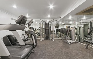 a gym with treadmills and other exercise equipment