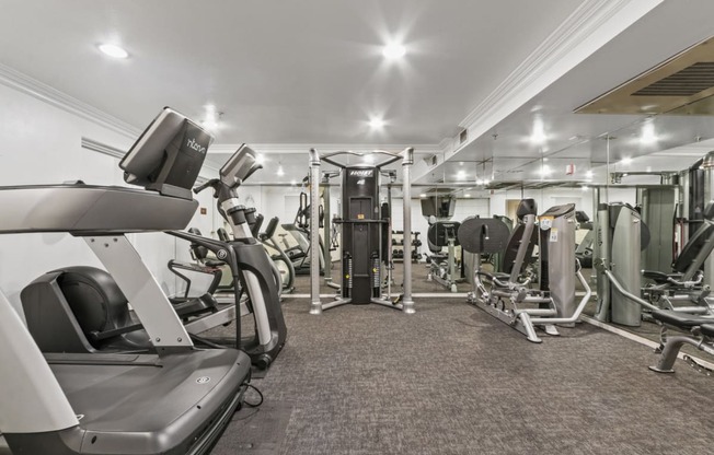 a gym with treadmills and other exercise equipment