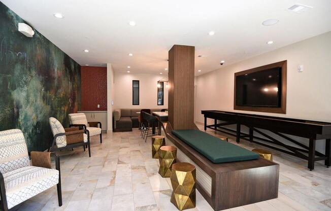 a large living room with a pool table and a television
