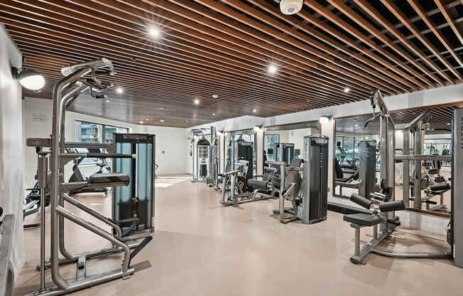 Renovated Fitness Center with a variety of equipment including a leg press machine.