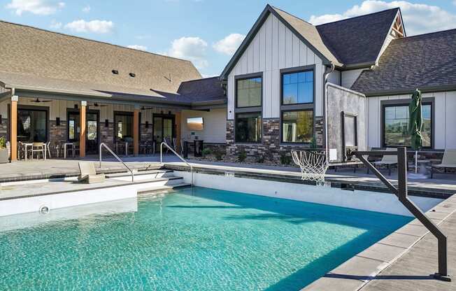 a swimming pool in front of a house