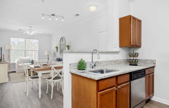A kitchen with a table and chairs in the dining area.