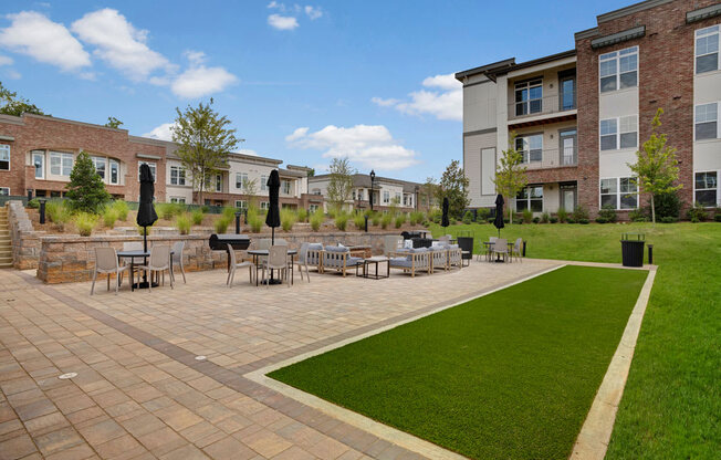 Outdoor seating, fire pit, and grill at Apartments @ Eleven240, North Carolina