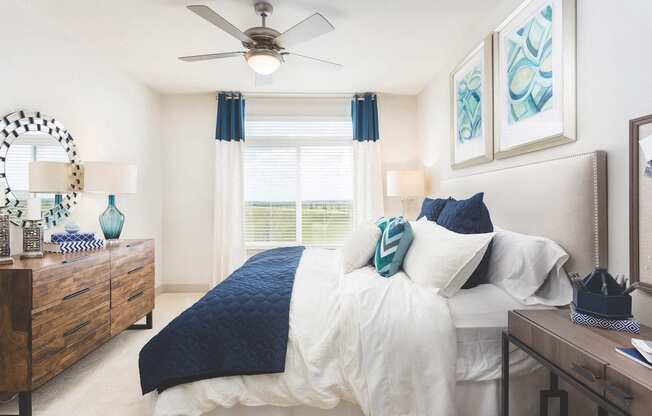Spacious furnished bedroom with ceiling fan  at LandonHouse Apartments in Lake Nona, Orlando, FL 32827