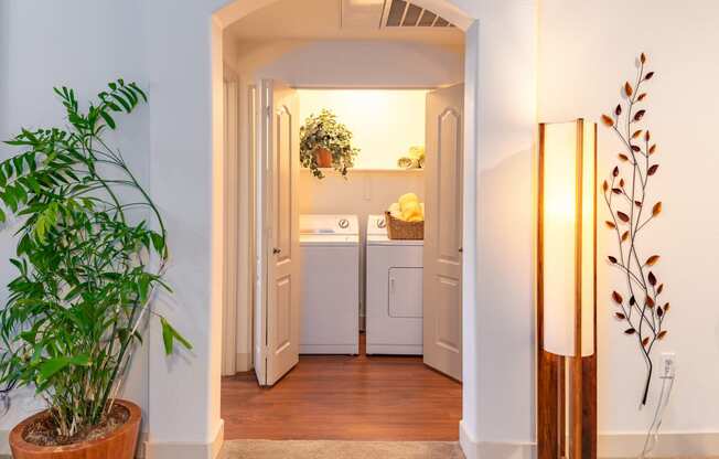a small laundry room with a washer and dryer