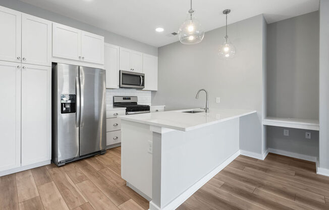 a large white kitchen with a stainless steel refrigerator at Madison Prickett Preserve, Pennsylvania