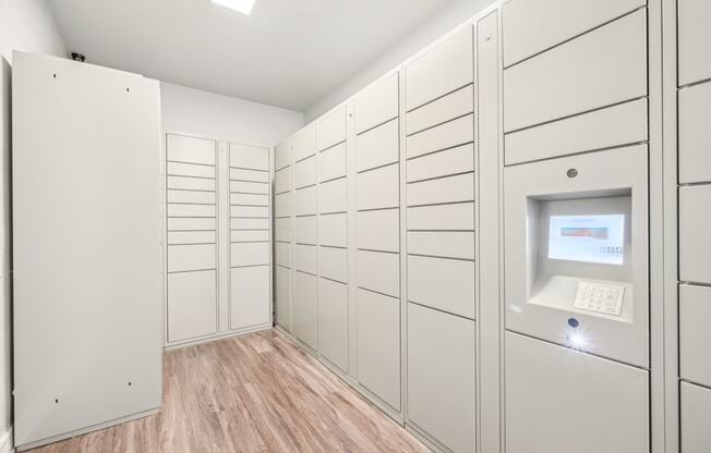 a large white closet with a computer in it