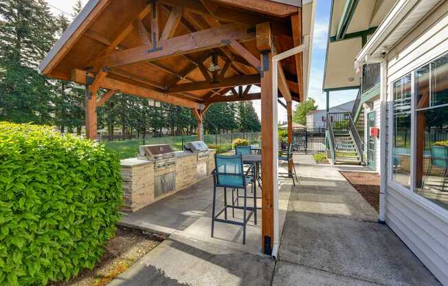Outdoor BBQ Area with Canopy at Landings at Morrison Apartments located in Gresham, OR.