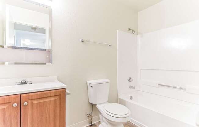 a bathroom with a toilet sink and bathtub