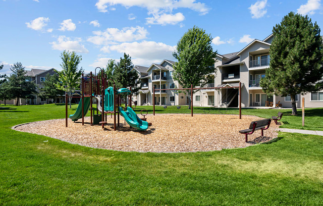 the preserve at ballantyne commons playground with play equipment and apartments in the background
