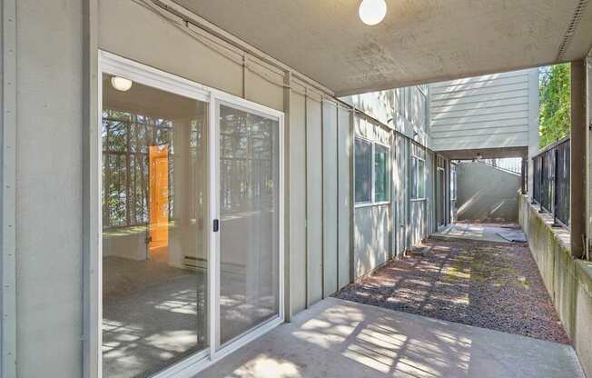 A long hallway with glass doors and windows.