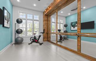 A room with a blue wall and a wooden beam ceiling.