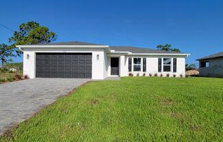 Spacious 4BR, 2 bath, 2 car garage features 1,650 sqft. of living space & Screened Lanai in Cape Coral – Pet-Friendly!