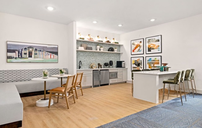 a living room with a kitchen and a dining table