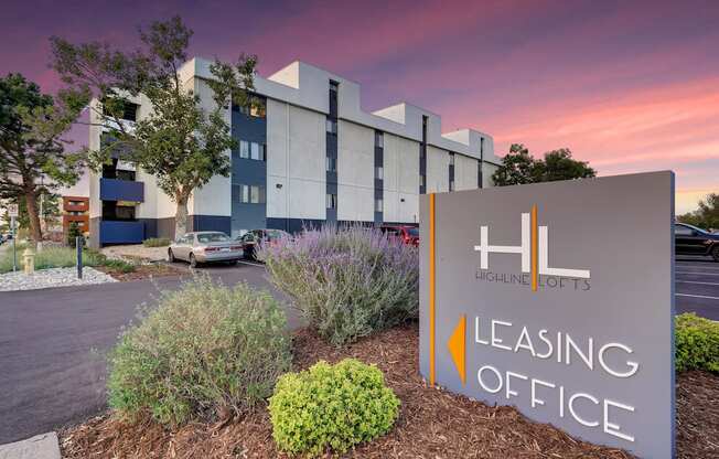 a building with a leasing office sign in front of it