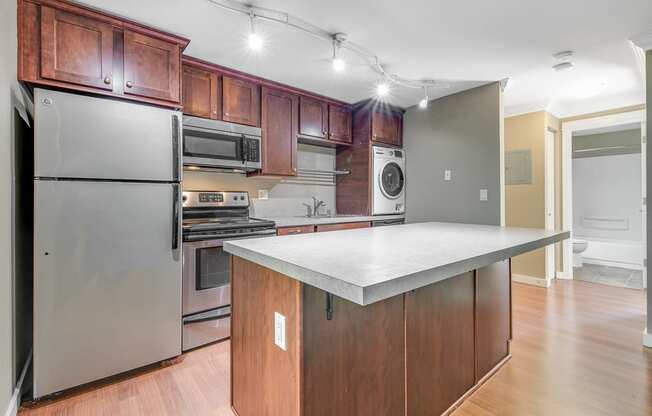 Kitchen Island and Kitchen at Whispering Brook Apartments, Washington