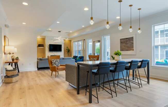 a living room filled with furniture and a large window