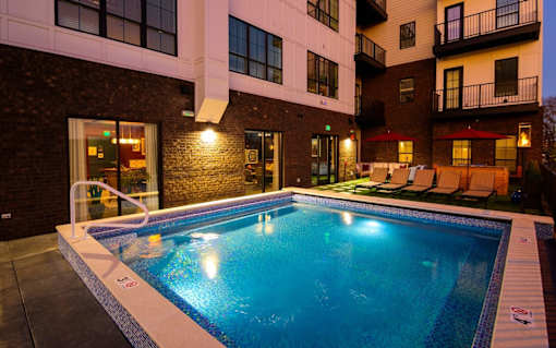 a swimming pool in front of a building at Fairfax, Ohio