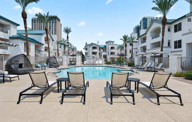 Exterior resort style pool and spa with outdoor lounge seating