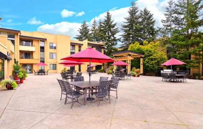12 Central Square outdoor area with tables and seating and red umbrella