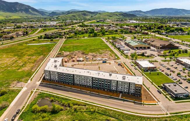 A large building with a parking lot in front of it.