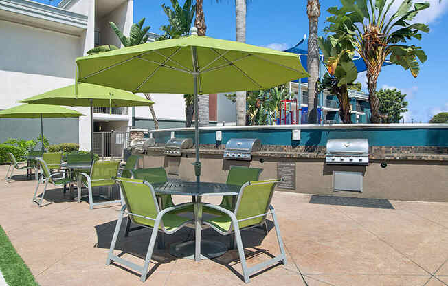 Outdoor BBQ Area with Lounge Furniture at Madison Park Apartments located in Anaheim, CA.