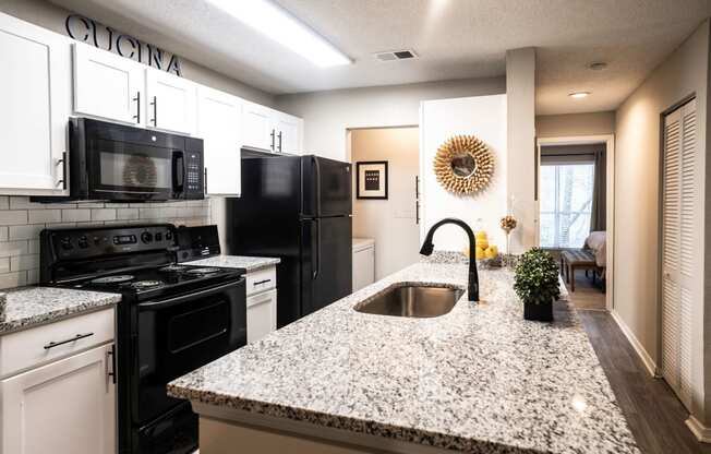 Modern Kitchen with Granite Countertops and Black Appliances  at Grove Point, Norcross, GA, 30093