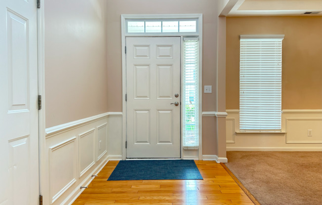 Charming Wakefield Home with First-Floor Bedroom & Primary Suite, Fenced-in Backyard, and Golf Course Views – Available Now!