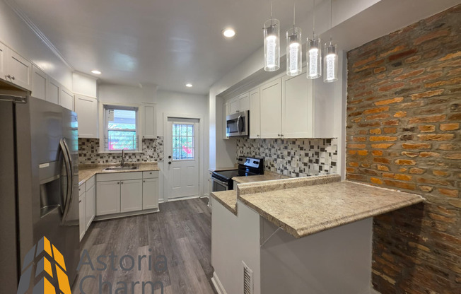 3 Bedroom End Unit with Finished Basement and Fenced Yard on E 28th Street