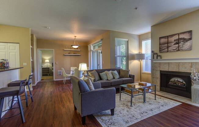 Living Area With Fireplace at Commons at Verandas in Tanasbourne Apartments, Oregon