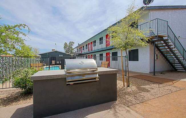 A silver car is parked on a concrete block.