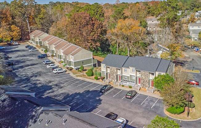 Element at 4411 Macon Apartments A parking lot with a building in the background.