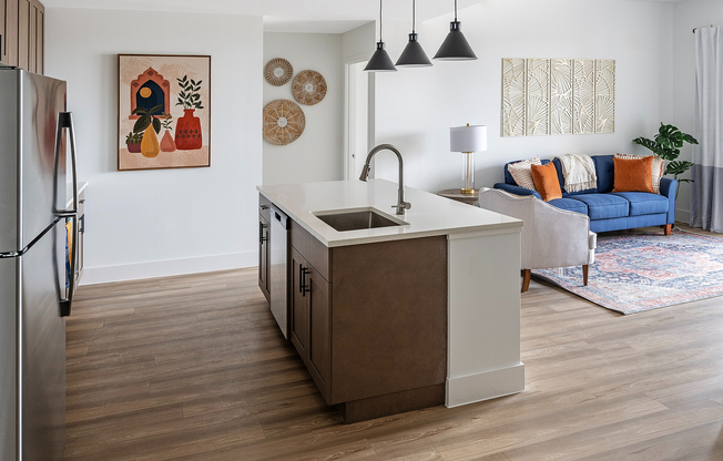 Step into this chic open-concept living area, perfectly blending style and comfort.