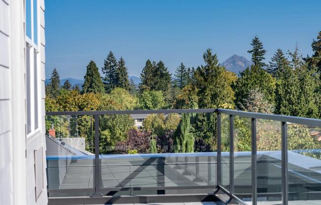 Enjoy fresh air and scenic views from private balconies and patios, available in select homes at Modera Woodstock.