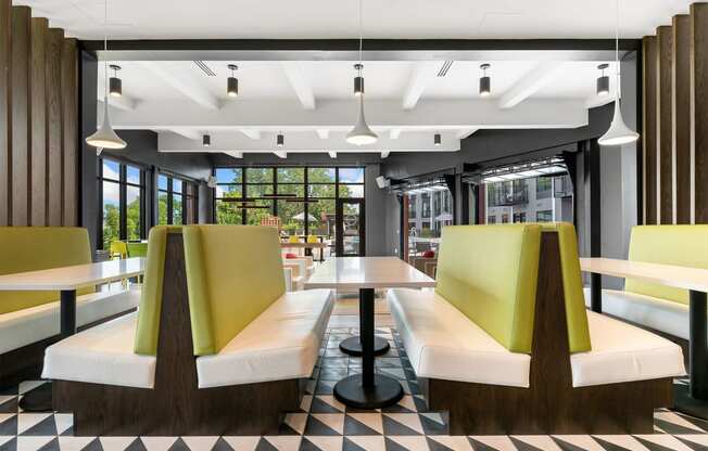 a rendering of a restaurant with yellow booths and a checkered floor