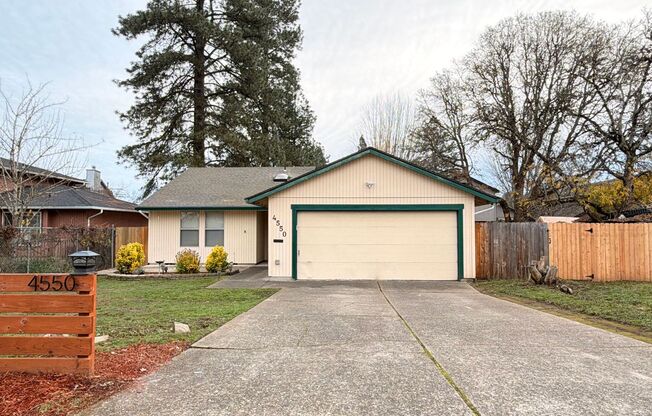 Comfortable Beaverton Home with AC, Fireplace, Large Fenced Yard, Spacious Garage and W/D!
