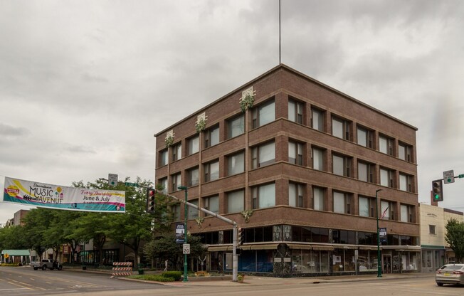 a large brick building on the corner of a street