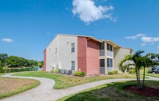 1 Bedroom/1 Bath with a Den/Office Area- Screened Lanai- Water Views-Corner Unit- No Upstairs Neighbors!!