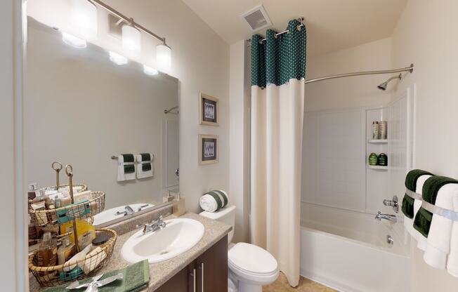Hallway bathroom with sink, toilet, shower and tub