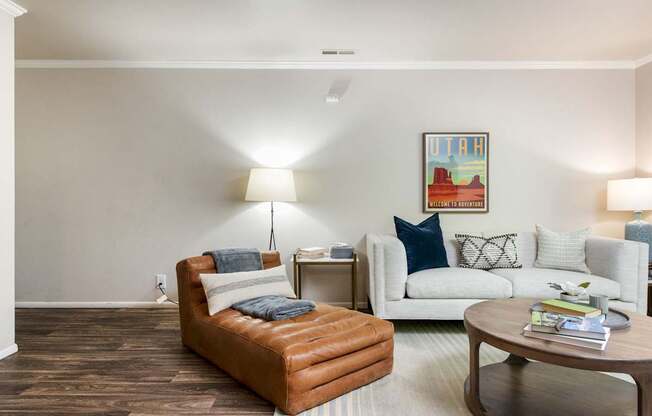 a living room with a couch and a chair and a table