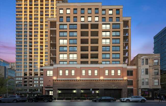 a tall building on a city street with cars at Chateau on Wells, Illinois, 60654