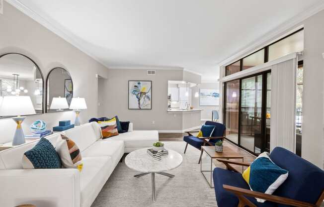 a living room with a white couch and a table