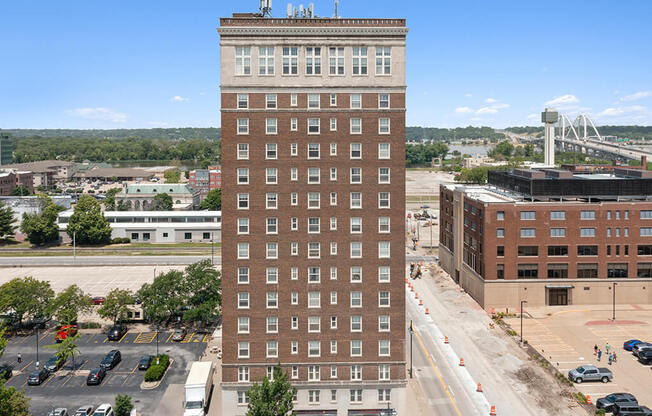 an aerial view of a tall building in a city