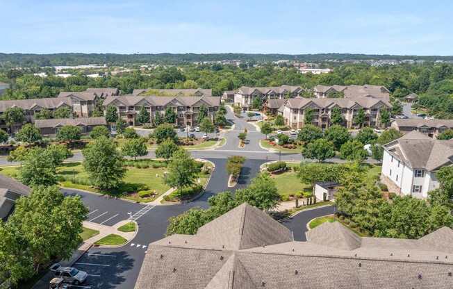 A residential area with houses and a road.