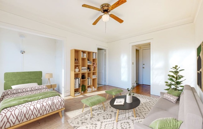 Spacious Bedroom with Intricate Bookshelves and Restored Hardwood Flooring at The Park Apartments in Minneapolis, 55403