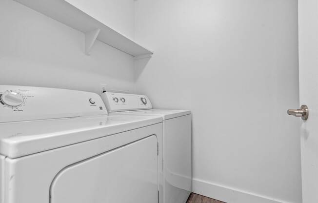 a laundry room with a washer and dryer