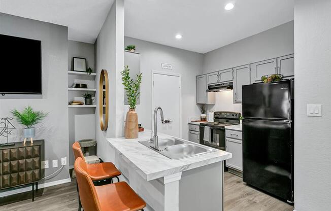 a kitchen with a sink and a counter top