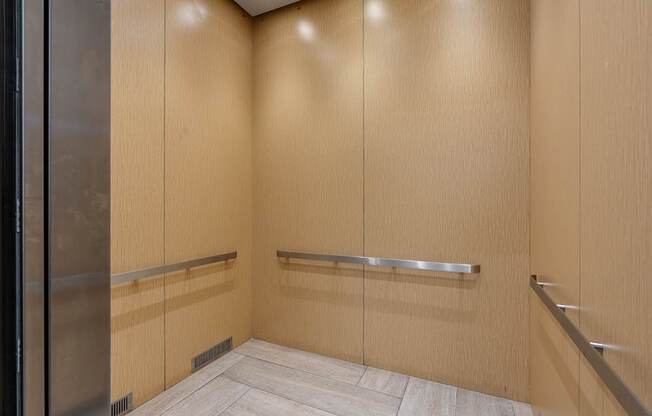 a large closet in a bathroom with mirrored doors
