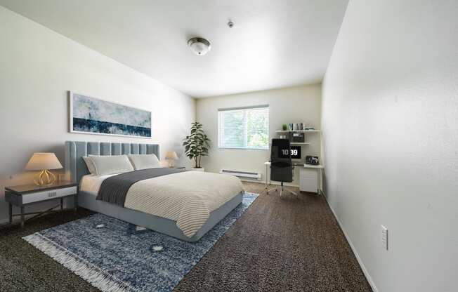 a bedroom with a bed and a desk at Mill Pond Apartments, Washington