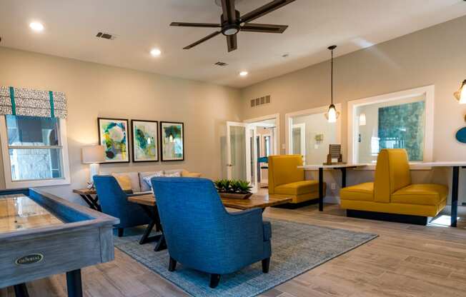 a living room with couches chairs and a table